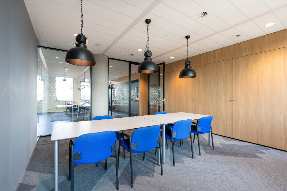 meeting-room-interior-modern office with long wooden table chairs around it